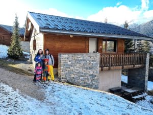 Chalet 96 family in front of the chalet